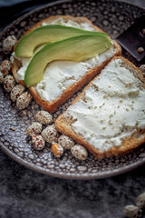 Launch with Dietary sandwiches with grain bread, cream cheese and avocado