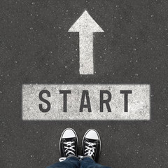 Woman standing near arrow on asphalt, top view. Choice concept