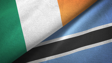 Ireland and Botswana two flags textile cloth, fabric texture