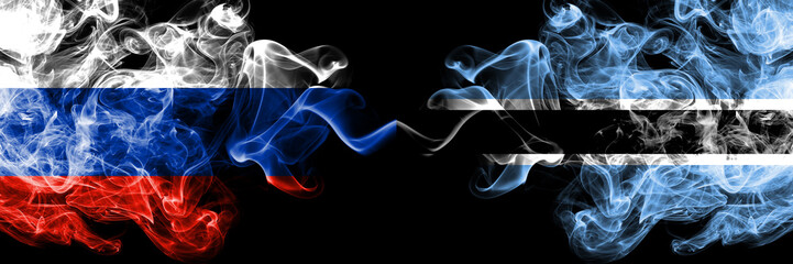 Russian vs Botswana, Botswanan smoke flags placed side by side. Thick colored silky smoke flags of Russia and Botswana, Botswanan