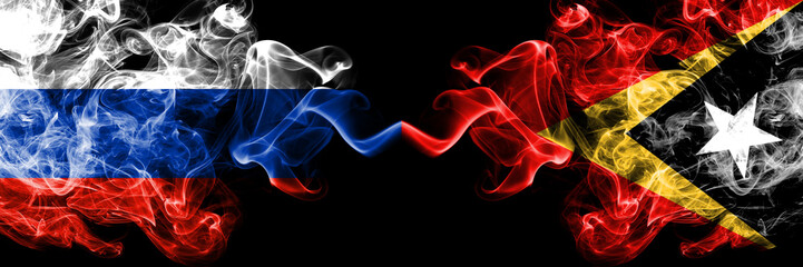 Russian vs East Timor smoke flags placed side by side. Thick colored silky smoke flags of Russia and East Timor