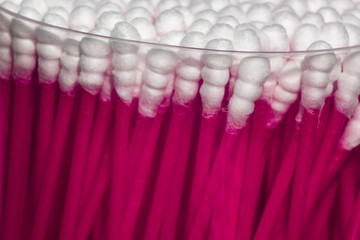 Fototapeta na wymiar Packing cotton swabs with magenta color
