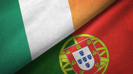 Ireland and Portugal two flags textile cloth, fabric texture