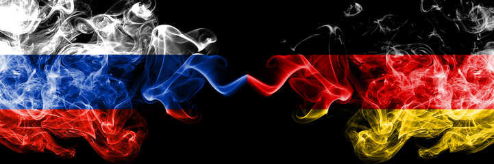 Russian vs Germany, German smoke flags placed side by side. Thick colored silky smoke flags of Russia and Germany, German