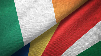 Ireland and Seychelles two flags textile cloth, fabric texture