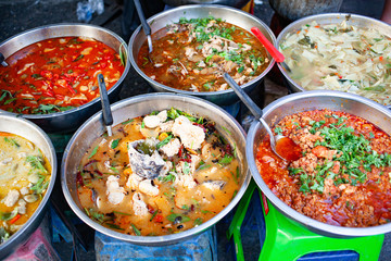 delicious fresh street food in Thailand - top view - Thai Curry, Tamarind, Tom Yam, Shrimp, Pork, Pad Thai