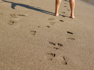 beach sand and bare feet