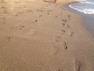 beach sand and bare feet