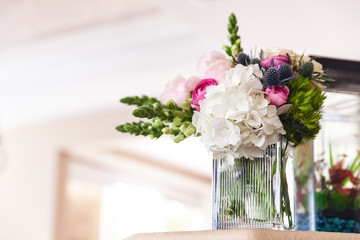 Wedding flowers in a vase in the morning before a ceremony