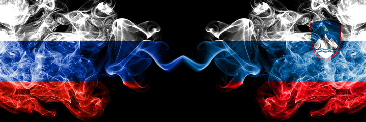 Russian vs Slovenia, Slovenian smoke flags placed side by side. Thick colored silky smoke flags of Russia and Slovenia, Slovenian
