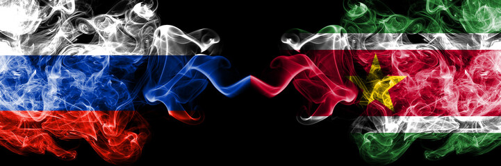 Russian vs Suriname, Surinamese smoke flags placed side by side. Thick colored silky smoke flags of Russia and Suriname, Surinamese