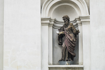 Ruined statue of Saint Paul on the facade of the Saint Peter and Paul Cathedral in Lutsk, Ukraine