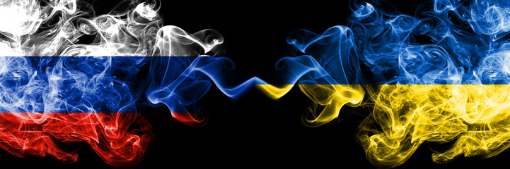 Russian vs Ukraine, Ukrainian smoke flags placed side by side. Thick colored silky smoke flags of Russia and Ukraine, Ukrainian