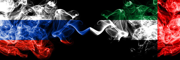 Russian vs United Arab Emirates, Emirati smoke flags placed side by side. Thick colored silky smoke flags of Russia and United Arab Emirates, Emirati