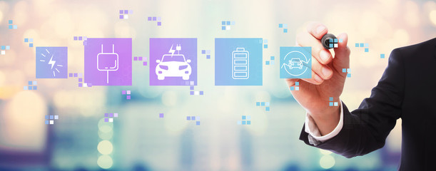 EV with businessman on blurred abstract background