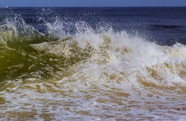 Rough seas and inclement weather breaking ocean waves