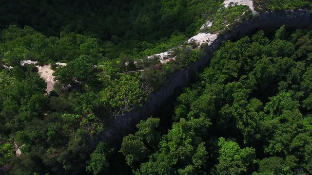 Tilt up aerial, cliffside in Daniel Boone National Forest