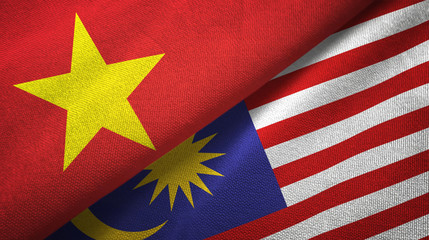 Vietnam and Malaysia two flags textile cloth, fabric texture