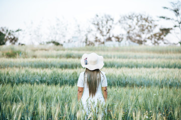 Woman in the hat happiness in the nature