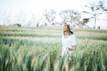 Woman in the hat happiness in the nature