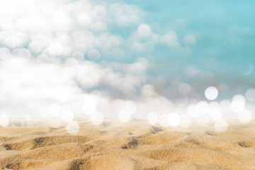 Fototapeta na wymiar Tropical nature clean beach and white sand in summer with sun light blue sky and bokeh background.