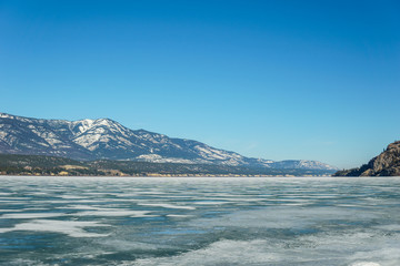 early spring landscape of frozen Columbia Lake Regional District of East Kootenay Canada.