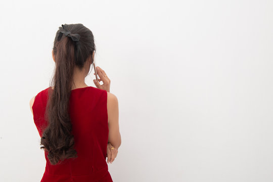  Portrait of asian business woman use cellphone on white background, back view and closeup portrait. Female holding smartphone back view, Free from copy space.