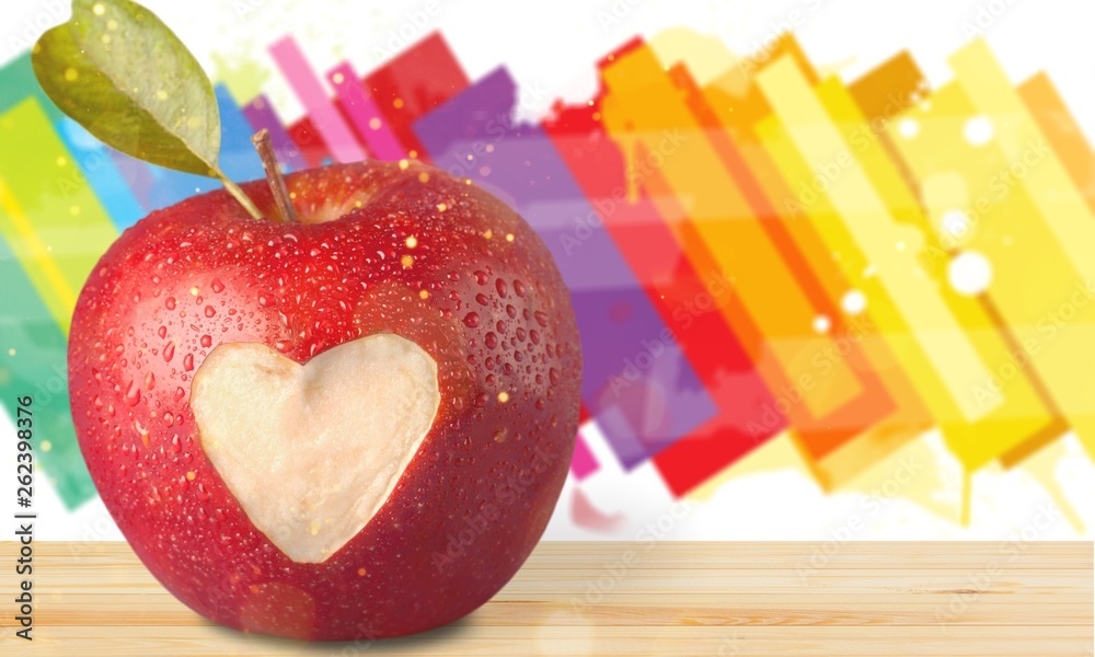 Canvas Prints red apple with a heart shaped cut-out on backgrouund