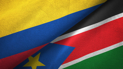 Fototapeta premium Colombia and South Sudan two flags textile cloth, fabric texture