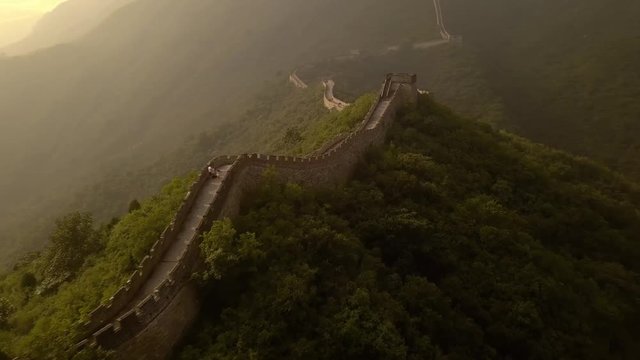 Flying over the Great Wall of china at Mutianyu at dusk