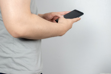 Man uses his Mobile Phone , close up