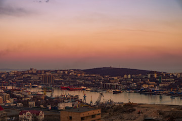 Panoramic view of the city of Vladivostok against the sunset.