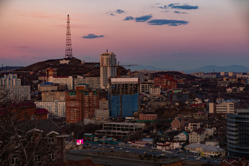 Panoramic view of the city of Vladivostok against the sunset.