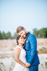 Asian bride and Caucasian groom have romance time and happy together