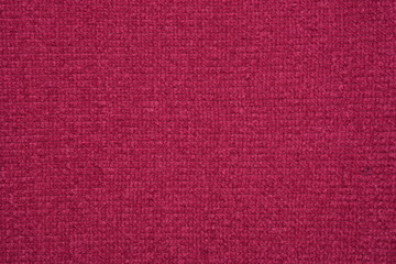 The texture of the knitted red fabric for the background 