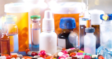 Colorful pills and tablets on background