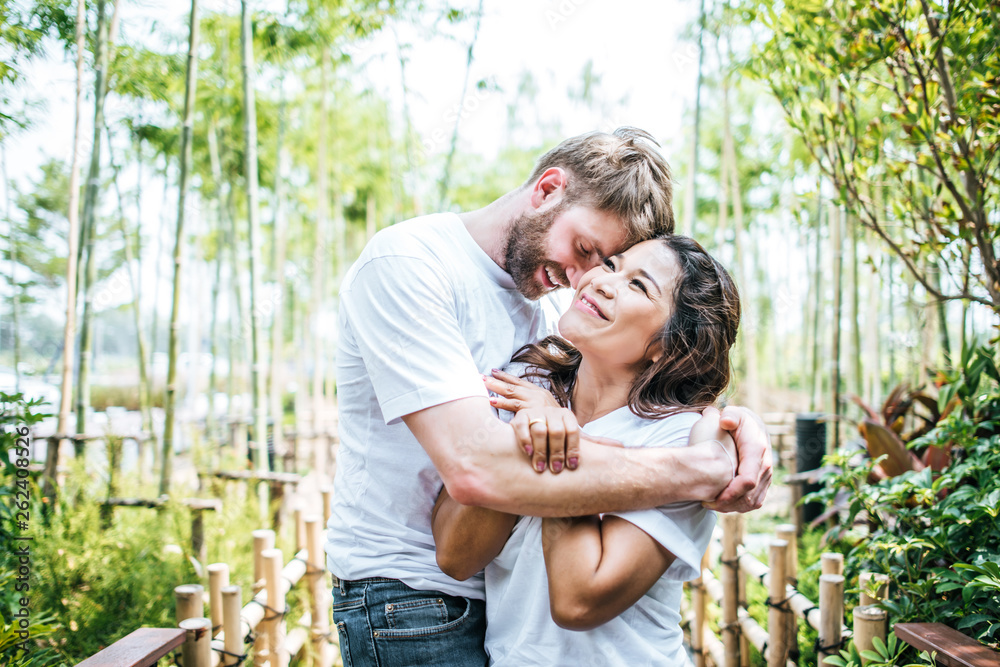 Wall mural Happy Smiling Couple diversity in love moment together