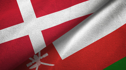 Denmark and Oman two flags textile cloth, fabric texture