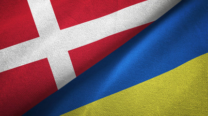 Denmark and Ukraine two flags textile cloth, fabric texture