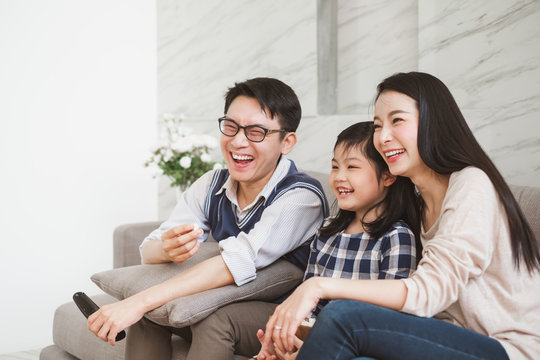 Happy Asian Family Lifestyle Enjoy Watching TV At Home