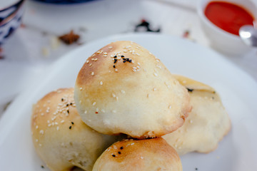 Tandir samsa on white plate.