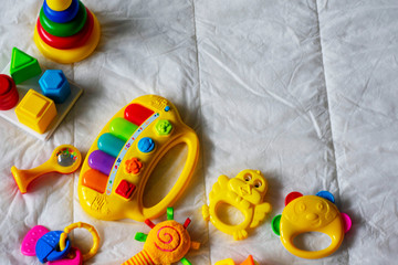 Kids bright colorful toys frame on white background. Top view. Flat lay. Copy space for text
