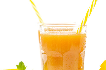 Fresh tropical fruit smoothie mango juice and fresh mango on a white background. Copy space.