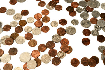 A pile of american cents scattered isolated on white