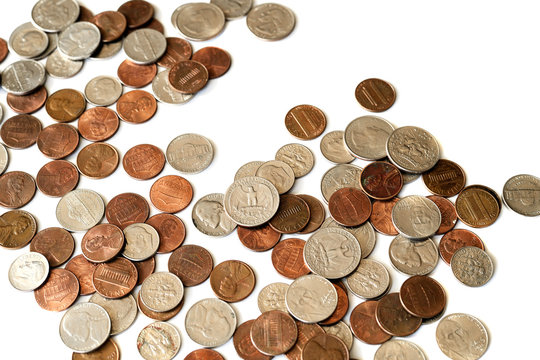 A pile of american cents scattered isolated on white