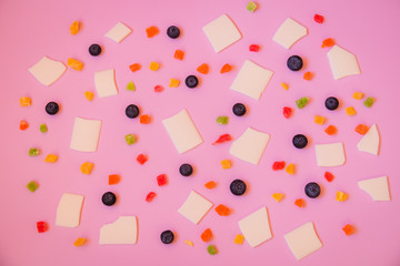 Blueberries, candied fruits and white chocolate chips as a background. Selective focus.