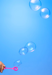 Soap bubbles on blue background