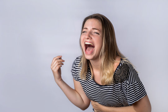 Young woman laughing.