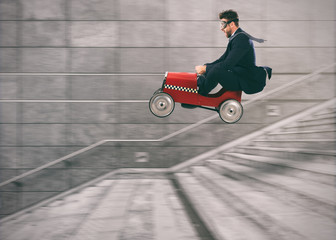Reckless business man goes down the stairs with a car to get before the others. Concept of success...