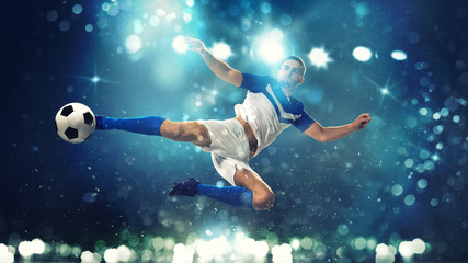 Obraz na płótnie Canvas Soccer striker hits the ball with an acrobatic kick in the air on dark blue background
